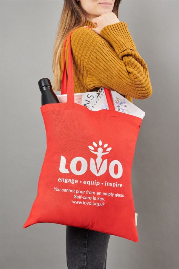 Woman with a LOVO bag on her shoulder